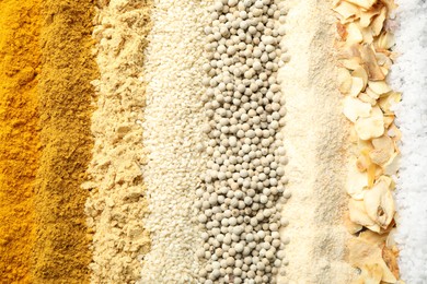 Photo of Many different spices as background, top view