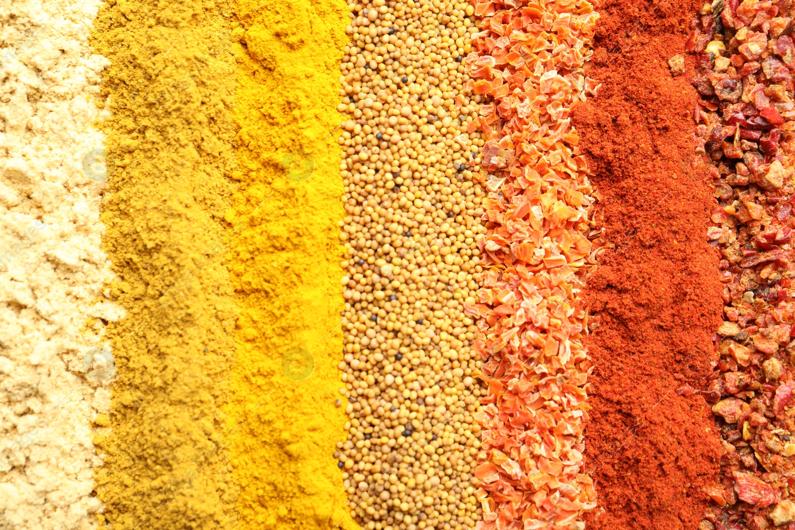 Many different spices as background, top view Photo of Many different spices as background, top view
