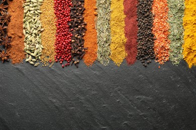 Photo of Many different spices on black table, flat lay. Space for text