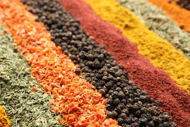 Photo of Many different spices as background, closeup view