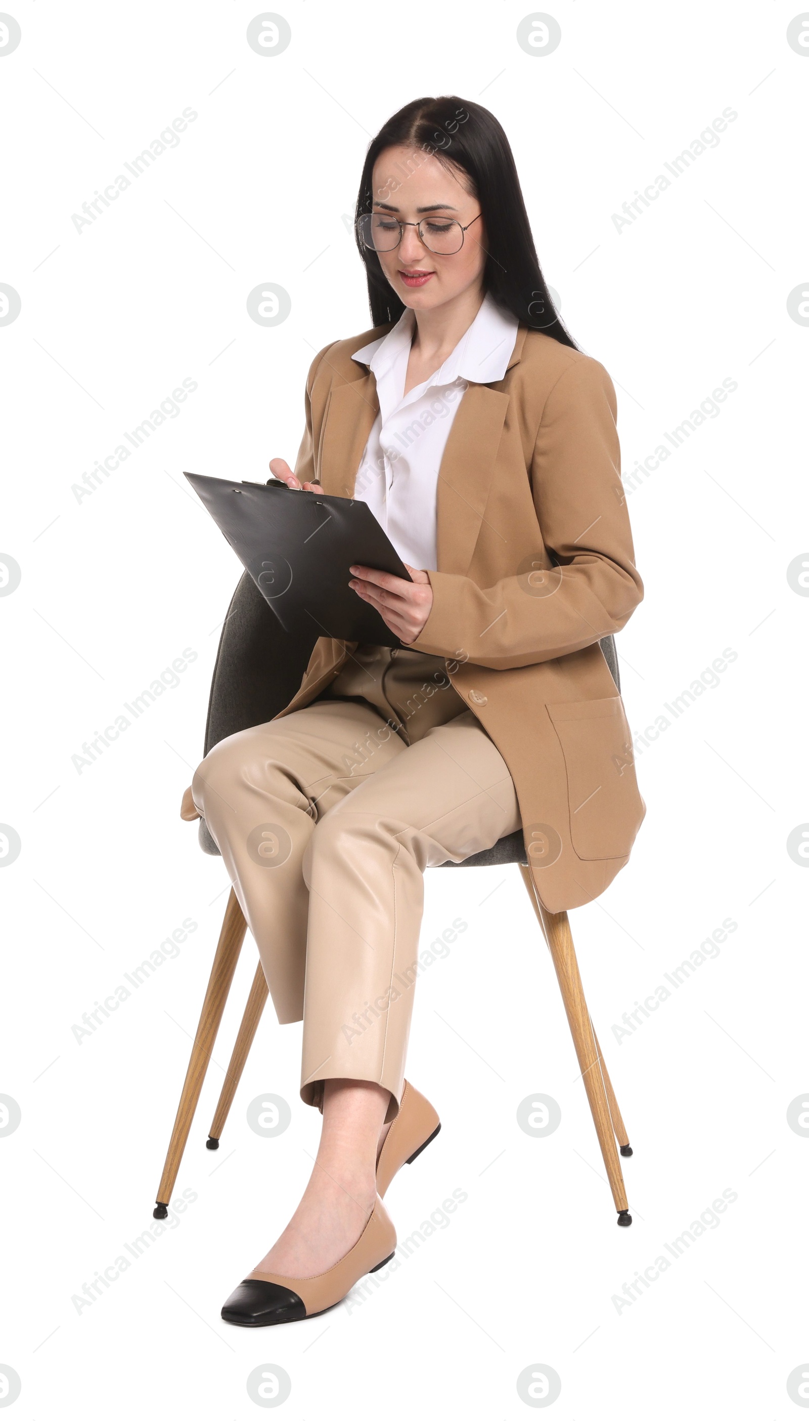 Professional psychologist with clipboard in chair on white background Photo of Professional psychologist with clipboard in chair on white background