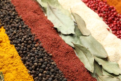 Photo of Many different spices as background, closeup view