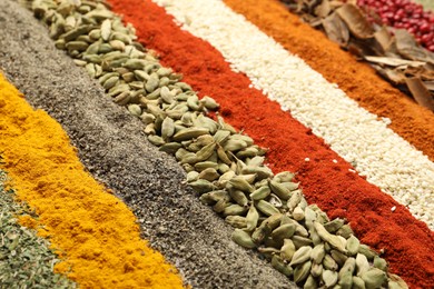 Photo of Many different spices as background, closeup view