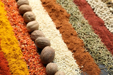 Photo of Many different spices as background, closeup view