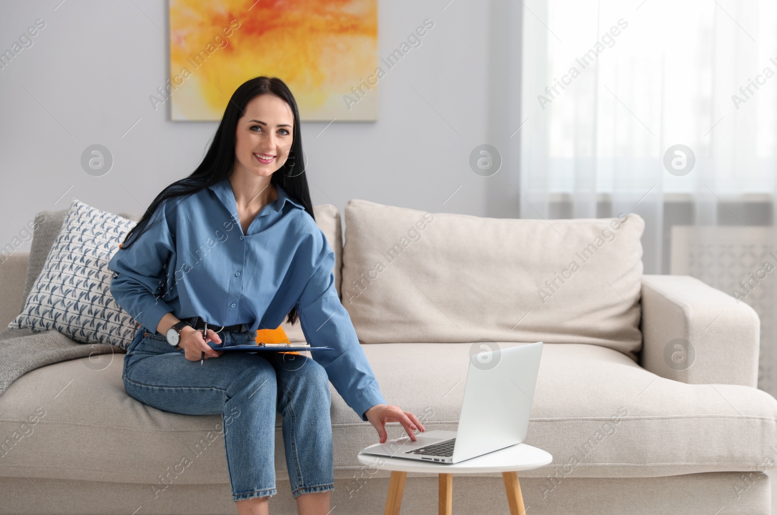 Professional psychologist working with laptop in office Photo of Professional psychologist working with laptop in office