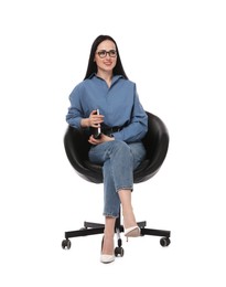Photo of Professional psychologist with notebook in office chair on white background