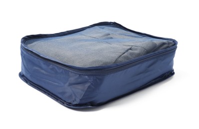 Photo of One packing cube with folded clothes isolated on white