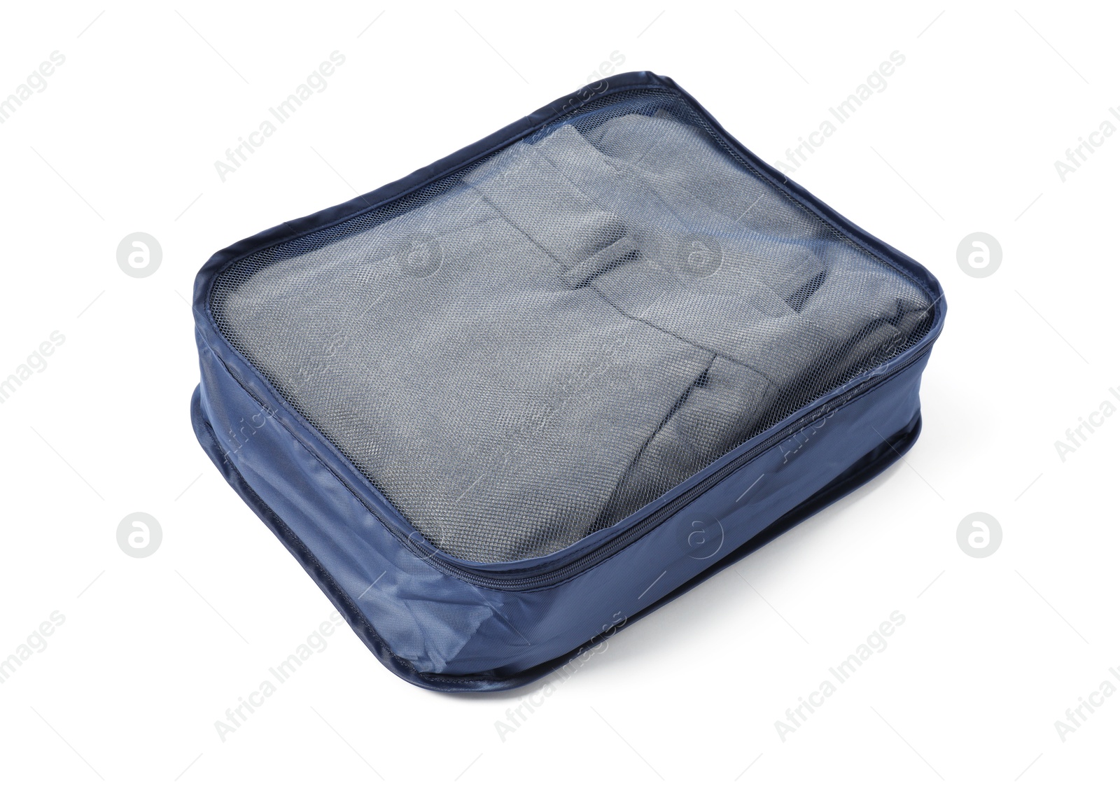 One packing cube with folded clothes isolated on white Photo of One packing cube with folded clothes isolated on white