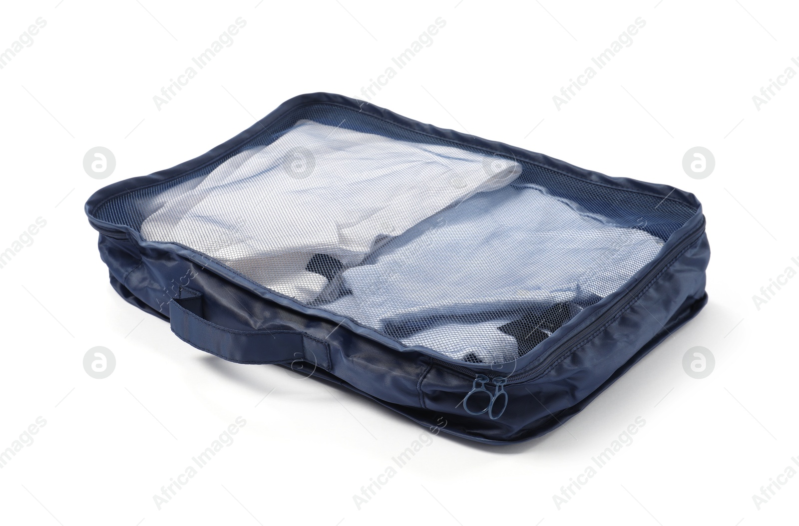 One packing cube with folded clothes isolated on white Photo of One packing cube with folded clothes isolated on white