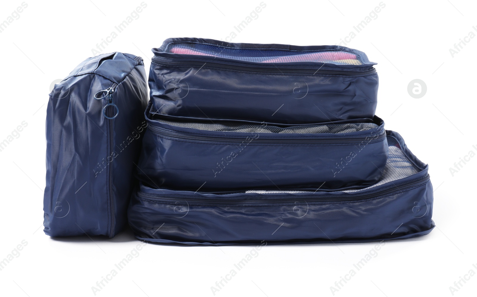 Blue packing cubes isolated on white. Storage organizer Photo of Blue packing cubes isolated on white. Storage organizer