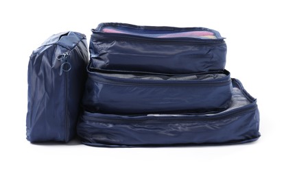 Photo of Blue packing cubes isolated on white. Storage organizer
