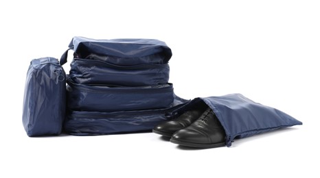 Photo of Blue packing cubes isolated on white. Storage organizer