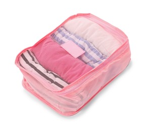 Photo of One packing cube with folded clothes isolated on white