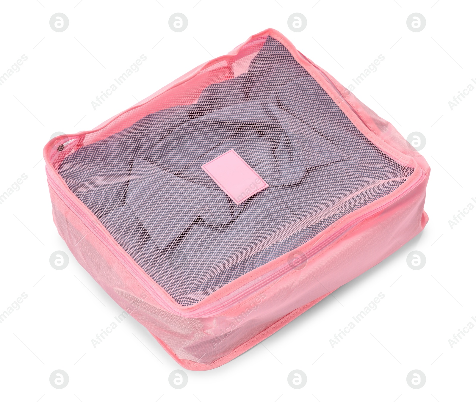One packing cube with folded clothes isolated on white Photo of One packing cube with folded clothes isolated on white