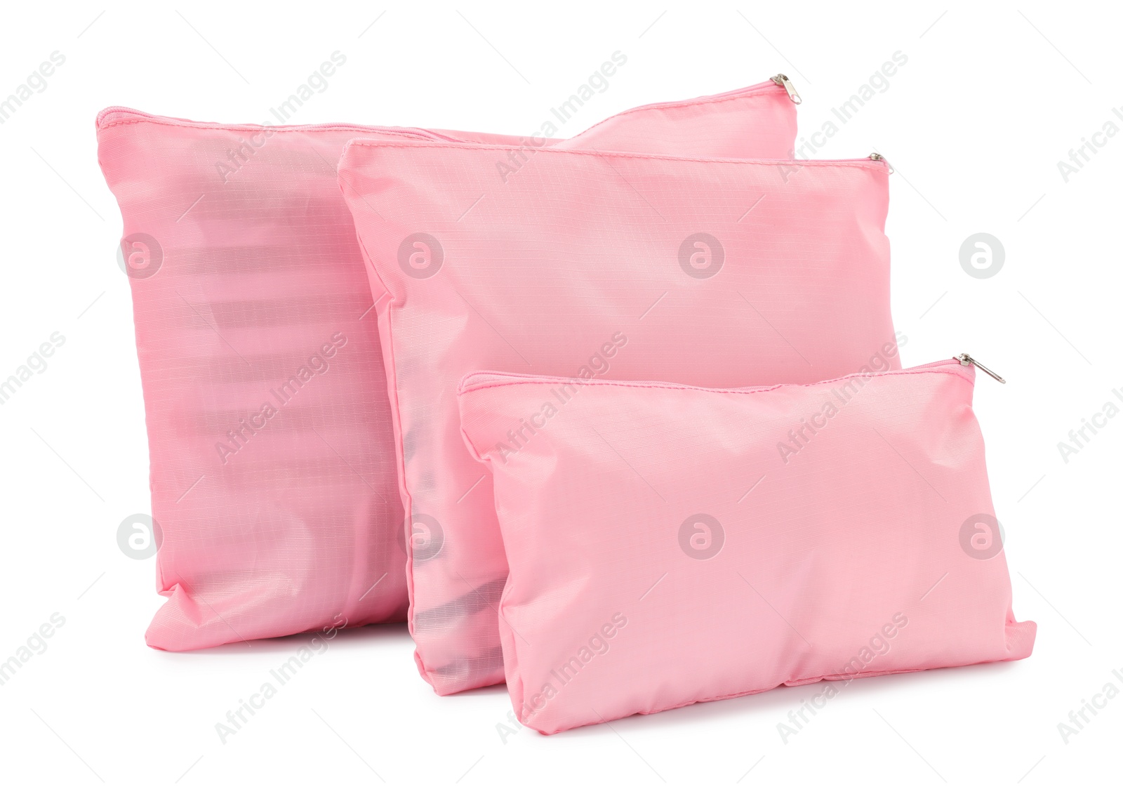 Pink packing bags isolated on white. Storage organizer Photo of Pink packing bags isolated on white. Storage organizer