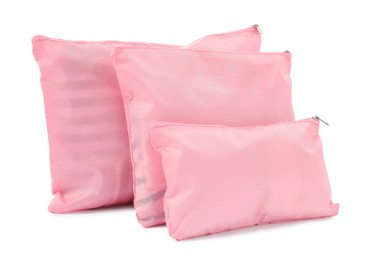 Photo of Pink packing bags isolated on white. Storage organizer