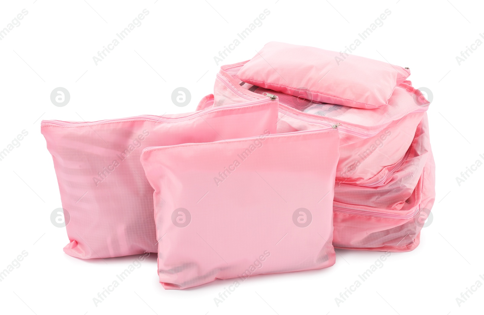 Pink packing cubes isolated on white. Storage organizer Photo of Pink packing cubes isolated on white. Storage organizer