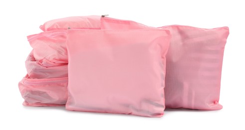 Photo of Pink packing cubes isolated on white. Storage organizer