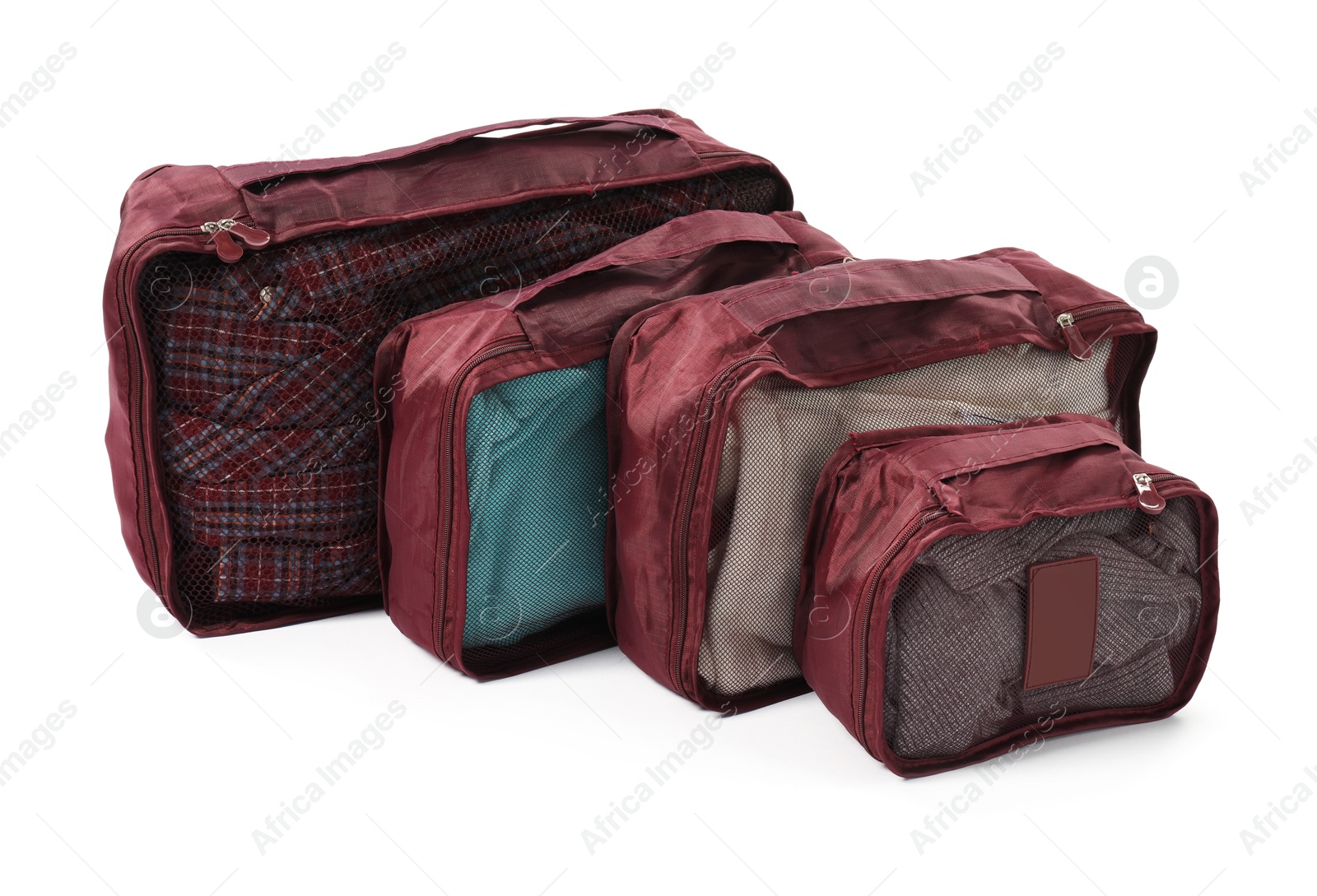 Brown packing cubes isolated on white. Storage organizer Photo of Brown packing cubes isolated on white. Storage organizer
