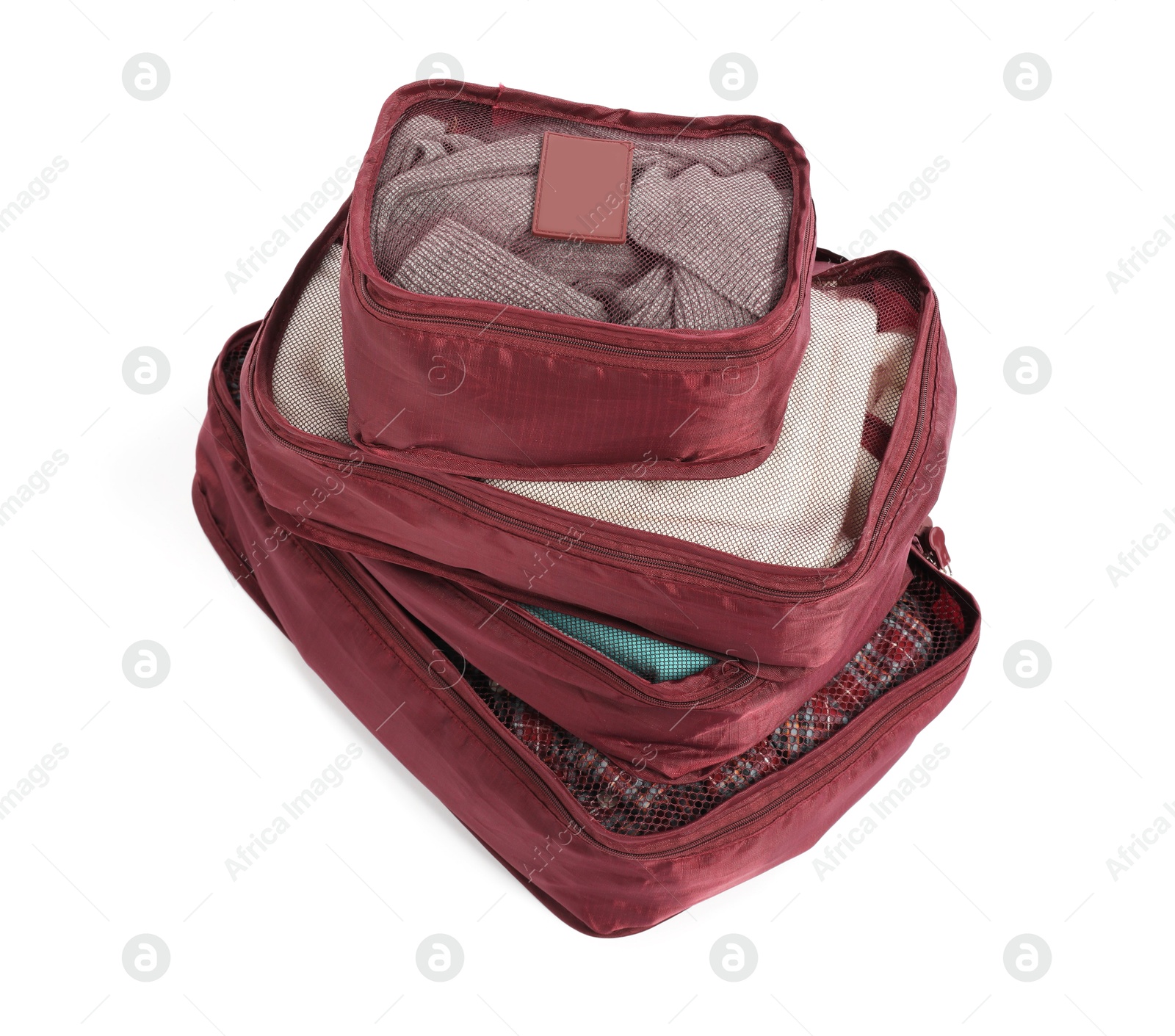 Stack of packing cubes isolated on white Photo of Stack of packing cubes isolated on white