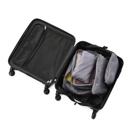 Photo of Open suitcase with packing cubes isolated on white, top view