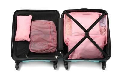 Photo of Open suitcase with packing cubes isolated on white, top view