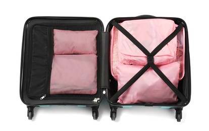 Photo of Open suitcase with packing cubes isolated on white, top view