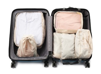 Photo of Open suitcase with packing cubes isolated on white, top view