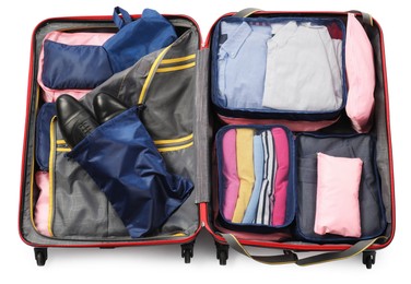 Photo of Open suitcase with packing cubes isolated on white, top view