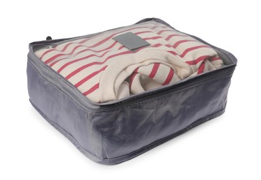Photo of Packing cube with folded clothes isolated on white