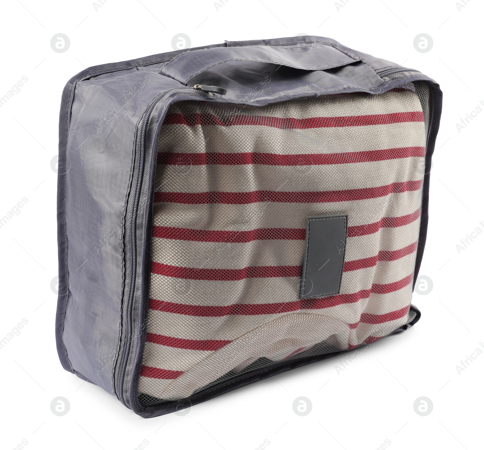 Packing cube with folded clothes isolated on white Photo of Packing cube with folded clothes isolated on white