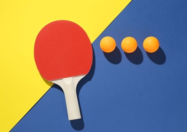 Photo of Ping pong racket and balls on color background, flat lay