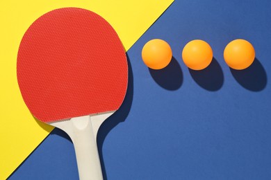 Photo of Ping pong racket and balls on color background, flat lay