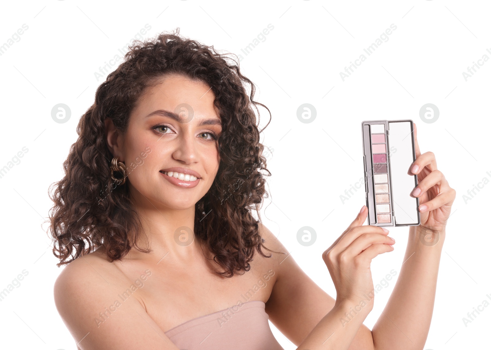 Smiling woman with eyeshadow palette on white background Photo of Smiling woman with eyeshadow palette on white background
