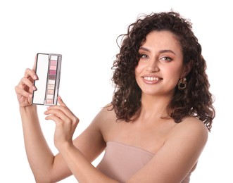 Photo of Smiling woman with eyeshadow palette on white background
