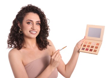 Photo of Smiling woman with eyeshadow palette and brush on white background