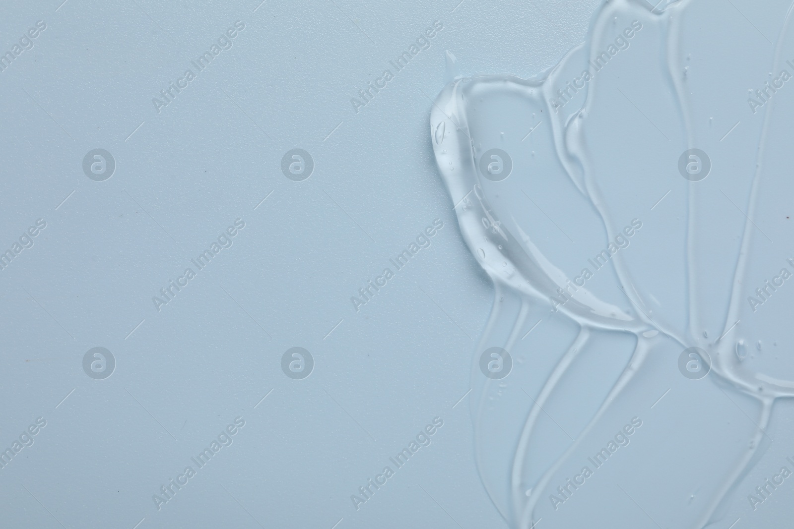 Collagen gel on light blue background, top view. Space for text Photo of Collagen gel on light blue background, top view. Space for text