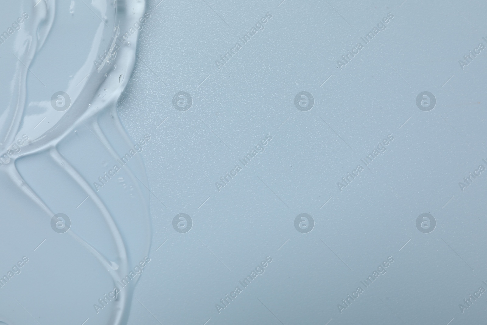 Collagen gel on light blue background, top view. Space for text Photo of Collagen gel on light blue background, top view. Space for text