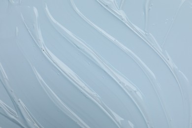 Photo of Collagen gel on light blue background, top view