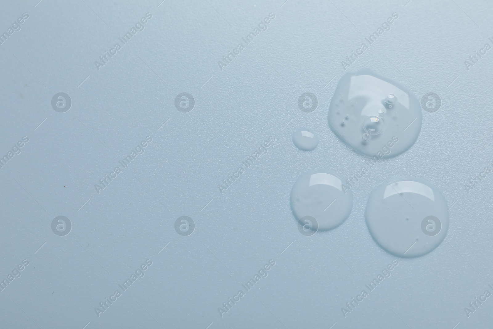 Collagen gel on light blue background, top view. Space for text Photo of Collagen gel on light blue background, top view. Space for text