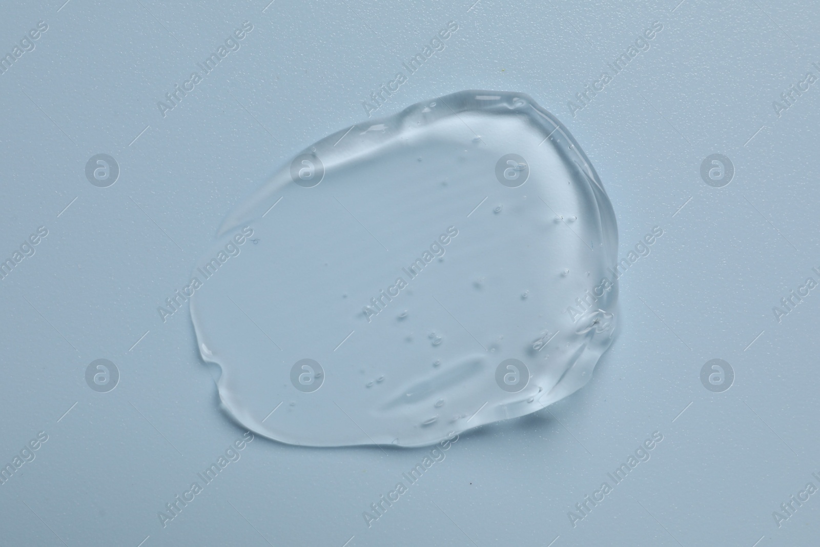 Collagen gel on light blue background, top view Photo of Collagen gel on light blue background, top view