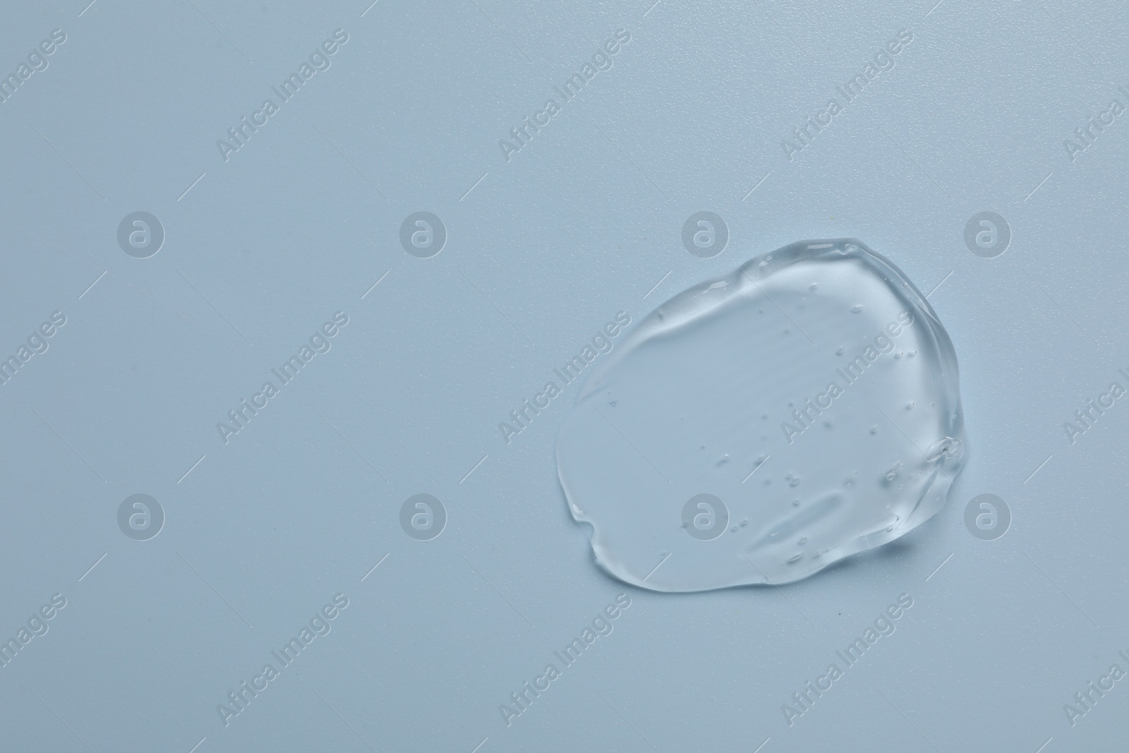 Collagen gel on light blue background, top view. Space for text Photo of Collagen gel on light blue background, top view. Space for text