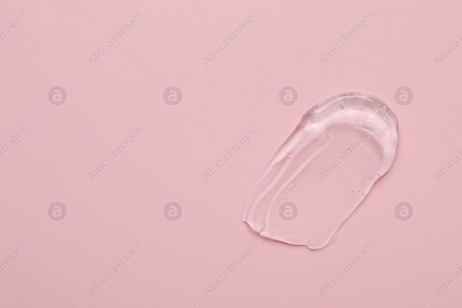 Collagen gel on pink background, top view. Space for text Photo of Collagen gel on pink background, top view. Space for text