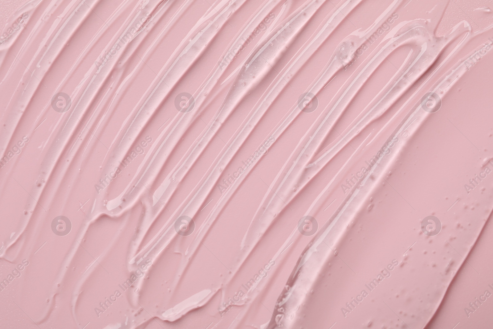 Collagen gel on pink background, closeup view Photo of Collagen gel on pink background, closeup view