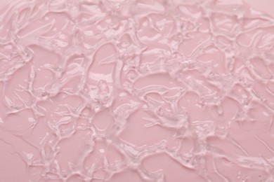 Photo of Collagen gel on pink background, above view