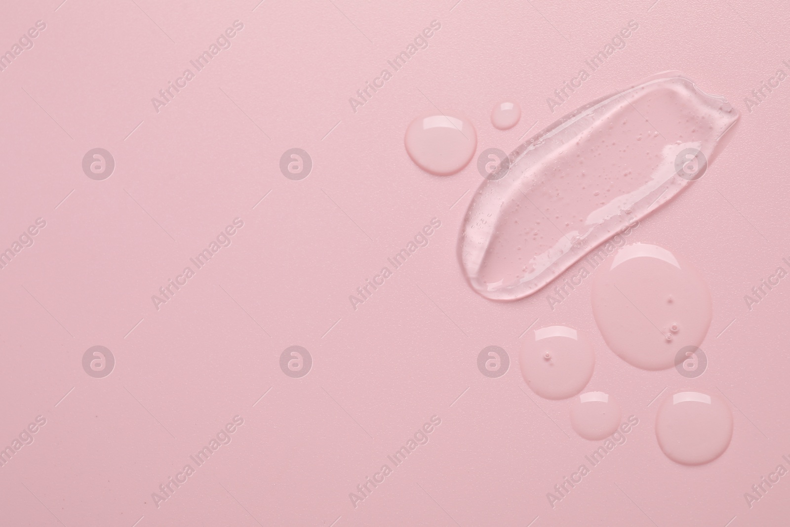 Photo of Collagen gel on pink background, top view. Space for text