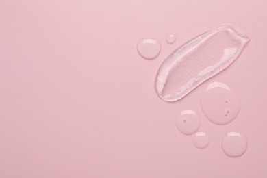 Photo of Collagen gel on pink background, top view. Space for text