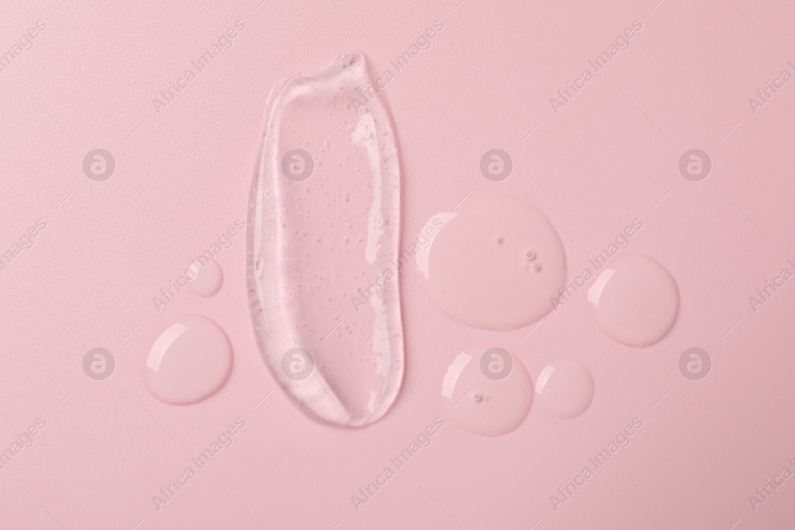 Collagen gel on pink background, top view Photo of Collagen gel on pink background, top view