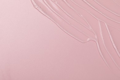 Photo of Collagen gel on pink background, top view. Space for text