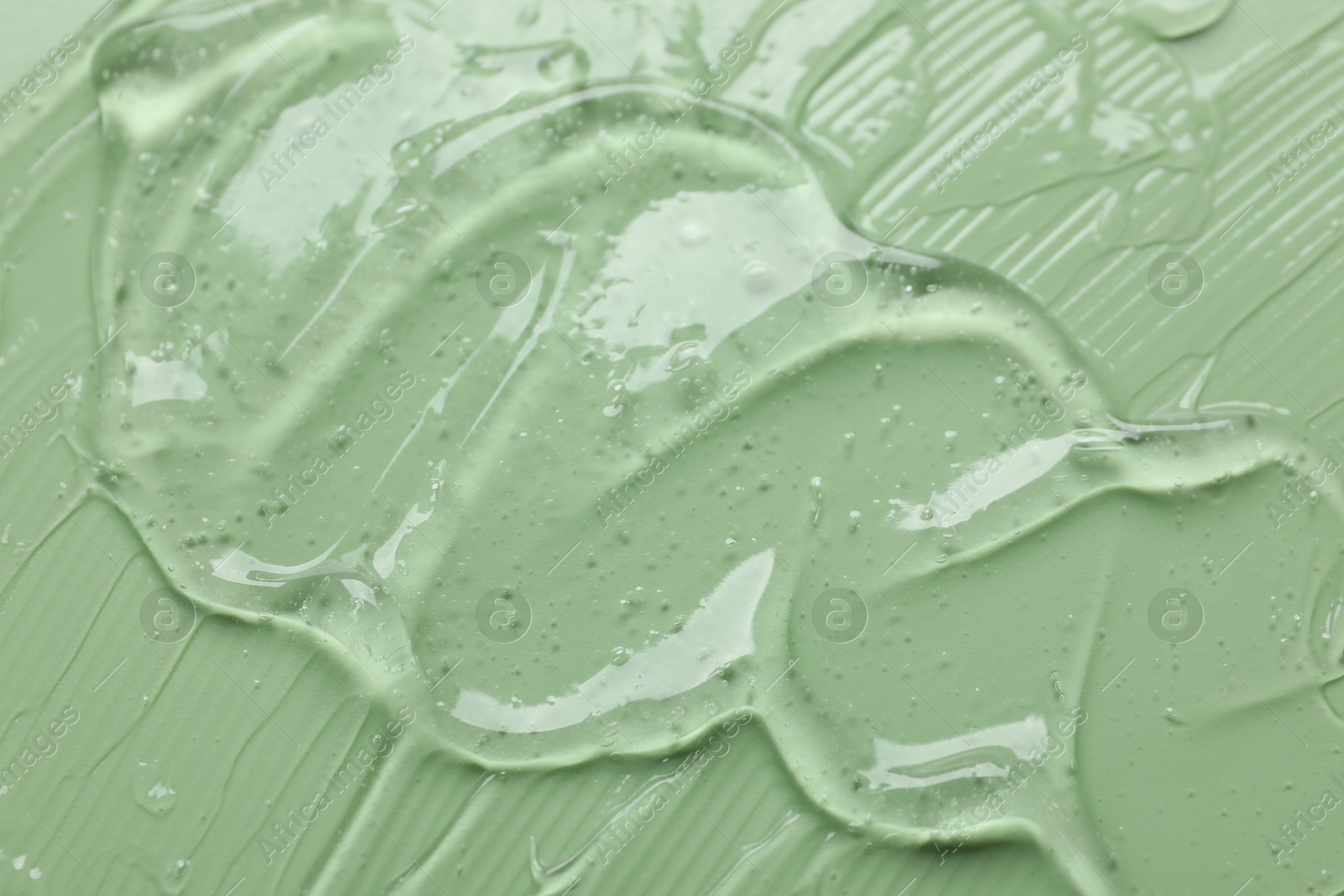 Collagen gel on green background, above view Photo of Collagen gel on green background, above view